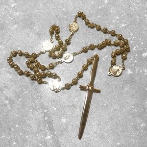PAMELA LOVE DAGGER ROSARY IN GOLD TONE